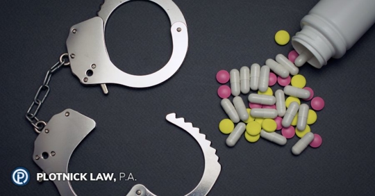 drug handcuffs and pills