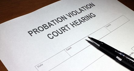 a paper that says probation violation court hearing.
